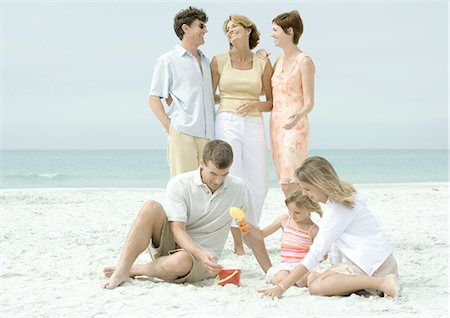 father and daughter discuss adult not children - Group on beach Stock Photo - Premium Royalty-Free, Code: 695-03388672