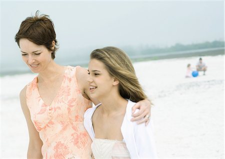 parents happy talk with teen - Woman walking with teenage daughter on beach Stock Photo - Premium Royalty-Free, Code: 695-03388680