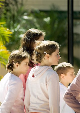 Group of children, looking in same direction Stock Photo - Premium Royalty-Free, Code: 695-03388795