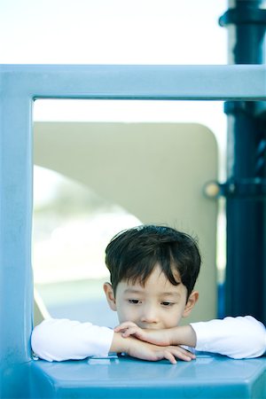 simsearch:632-03424260,k - Boy on playground equipment, looking down Stock Photo - Premium Royalty-Free, Code: 695-03389212