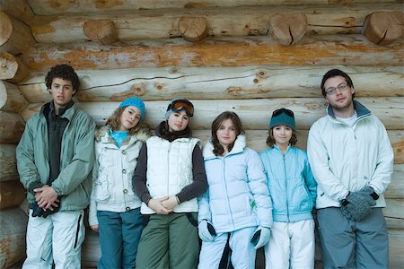 ski jacket for young adult girl - Young friends standing by log cabin, portrait Stock Photo - Premium Royalty-Free, Code: 695-03389266