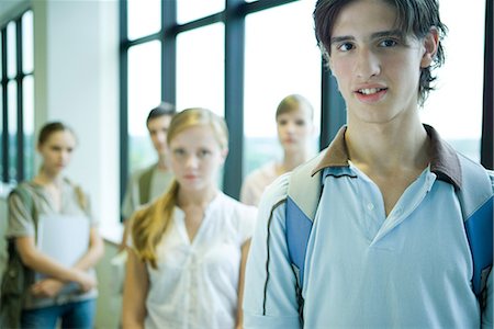 simsearch:632-03424176,k - Group of students standing, looking at camera, focus on male in foreground Foto de stock - Sin royalties Premium, Código: 695-03389410