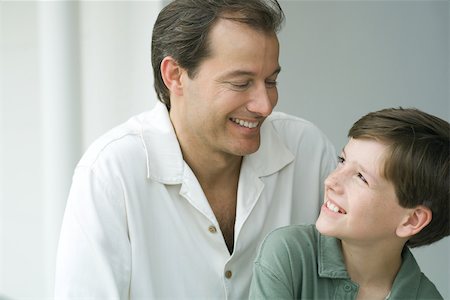 simsearch:695-03374588,k - Father and son smiling at each other, close-up Stock Photo - Premium Royalty-Free, Code: 695-03389608