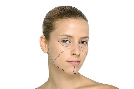 plastic surgery woman face - Young woman with plastic surgery markings on face, looking at camera Stock Photo - Premium Royalty-Free, Code: 695-03389824