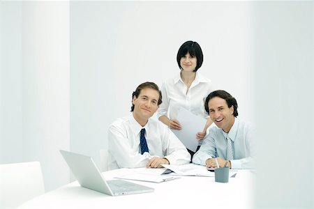 simsearch:695-03390369,k - Business associates in office, smiling at camera Stock Photo - Premium Royalty-Free, Code: 695-03389860