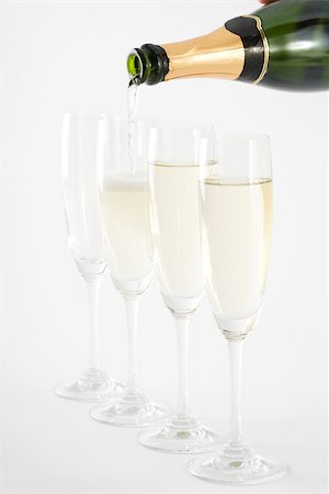 simsearch:695-03383548,k - Pouring champagne into glasses, close-up Fotografie stock - Premium Royalty-Free, Codice: 695-03389894