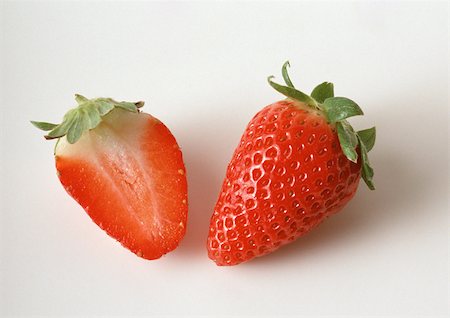 simsearch:632-06029440,k - Strawberry and strawberry half, close-up Stock Photo - Premium Royalty-Free, Code: 695-03380741