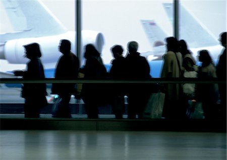 passenger inside airplane - People standing in line in airport, silhouette Stock Photo - Premium Royalty-Free, Code: 695-03380826