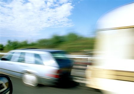 simsearch:622-02759377,k - Station wagon with mobile home attached, blurred motion Stock Photo - Premium Royalty-Free, Code: 695-03380958