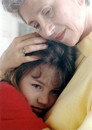 Senior hugging girl Stock Photo - Premium Royalty-Free, Code: 695-03380993