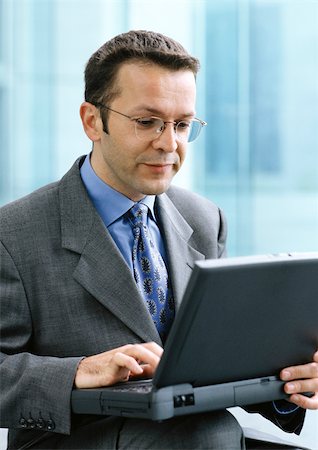 simsearch:632-01155457,k - Man using laptop computer Stock Photo - Premium Royalty-Free, Code: 695-03381222