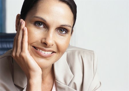 simsearch:632-01157433,k - Woman smiling, close-up Stock Photo - Premium Royalty-Free, Code: 695-03381244