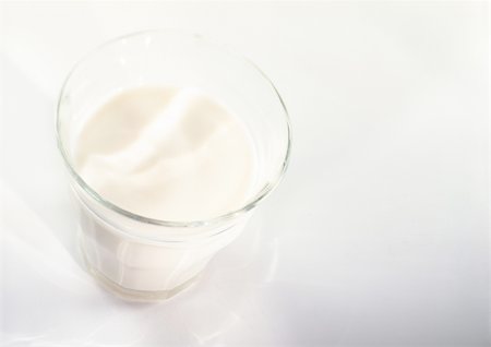 Glass of milk, elevated view Stock Photo - Premium Royalty-Free, Code: 695-03381484