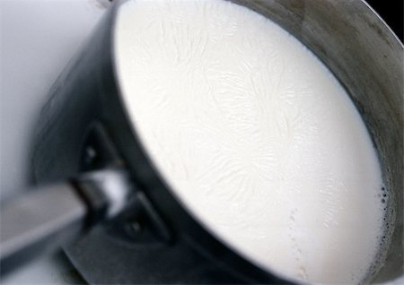 Milk in saucepan, close-up Stock Photo - Premium Royalty-Free, Code: 695-03381486