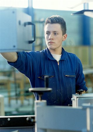 simsearch:614-05557261,k - Man in coveralls in workshop Stock Photo - Premium Royalty-Free, Code: 695-03381551