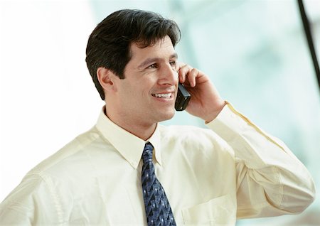 picture of person talking on string telephone - Businessman using cell phone, portrait Stock Photo - Premium Royalty-Free, Code: 695-03381601