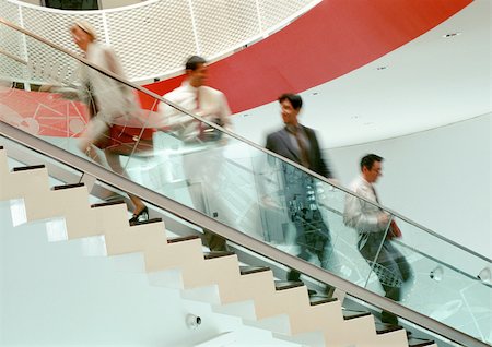 Business people on stairs, blurred Stock Photo - Premium Royalty-Free, Code: 695-03381631