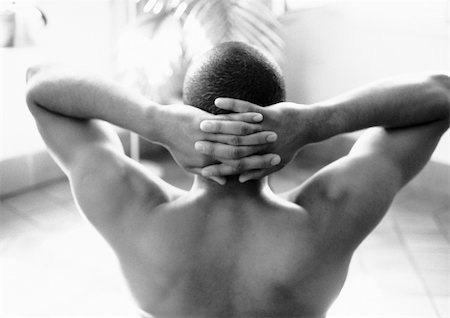 picture back muscles human body - Man with hands behind head, b&w Stock Photo - Premium Royalty-Free, Code: 695-03382145