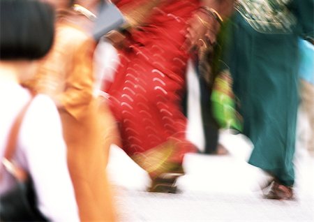 People walking in street, low section, blurred Stock Photo - Premium Royalty-Free, Code: 695-03382233