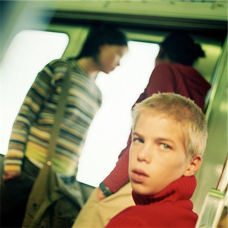 simsearch:695-03382580,k - Teenagers in train, blurred backbround Fotografie stock - Premium Royalty-Free, Codice: 695-03382264