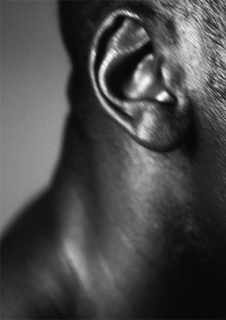 Man's ear, close up, black and white. Stock Photo - Premium Royalty-Free, Code: 695-03382436