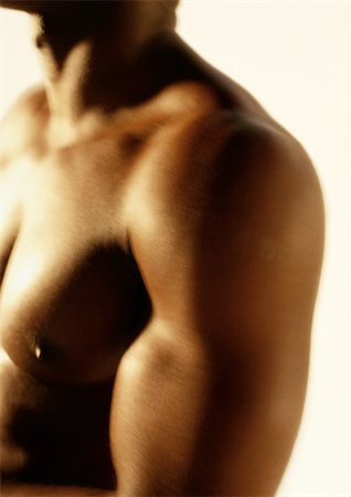 pecs - Man's bare chest and shoulder, close up. Foto de stock - Sin royalties Premium, Código: 695-03382453