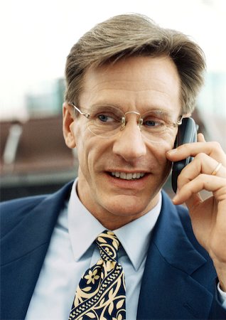simsearch:400-04485729,k - Businessman using cellular phone, front view, close-up, portrait. Stock Photo - Premium Royalty-Free, Code: 695-03382804