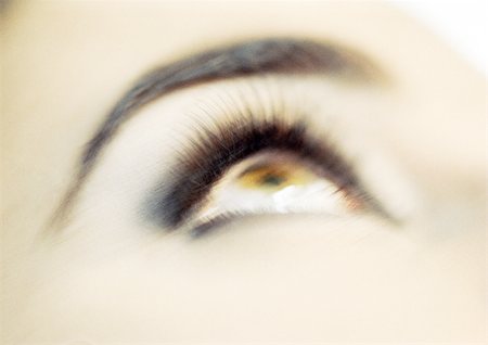 pupil (eye) - Woman's brown eye looking up, blurred close up. Stock Photo - Premium Royalty-Free, Code: 695-03383048