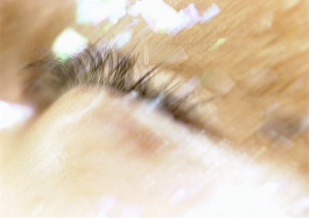 Woman's closed eye, make-up on face, extreme close-up, blurry. Stock Photo - Premium Royalty-Free, Code: 695-03383134