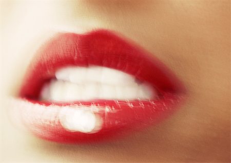 Woman wearing red lipstick, close up of open mouth, blurred. Stock Photo - Premium Royalty-Free, Code: 695-03383184