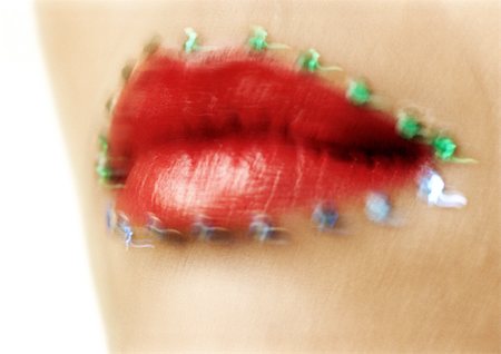 Woman wearing red lipstick, close up of mouth with jewel adornments, blurred. Stock Photo - Premium Royalty-Free, Code: 695-03383210