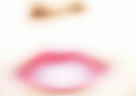 simsearch:640-02657383,k - Woman wearing pink lipstick, close up of mouth, blurred. Stock Photo - Premium Royalty-Free, Code: 695-03383213