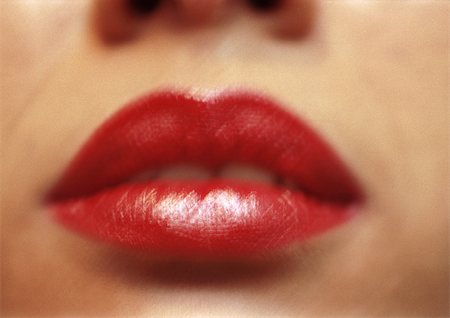simsearch:614-06897685,k - Femme portant le rouge à lèvres, près de la bouche, floue. Photographie de stock - Premium Libres de Droits, Code: 695-03383225