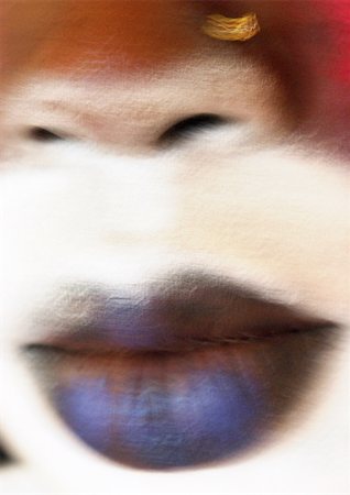 simsearch:614-06897685,k - Femme portant un rouge à lèvres foncé et maquillage visage blanc, près de la bouche, floue. Photographie de stock - Premium Libres de Droits, Code: 695-03383241