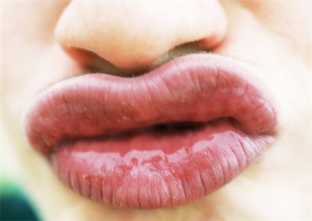 simsearch:632-05604008,k - Close up of woman's puckered lips Stock Photo - Premium Royalty-Free, Code: 695-03383251