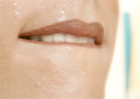 simsearch:695-03388489,k - Close up of woman biting her bottom lip. Fotografie stock - Premium Royalty-Free, Codice: 695-03383286