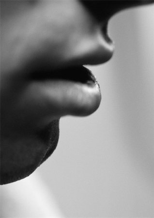 Man's lips, side view, close-up, black and white. Stock Photo - Premium Royalty-Free, Code: 695-03383534