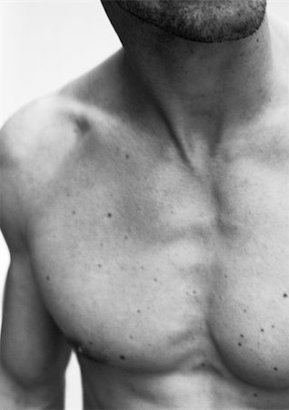 Man's bare chest, close-up, black and white. Stock Photo - Premium Royalty-Free, Code: 695-03383544