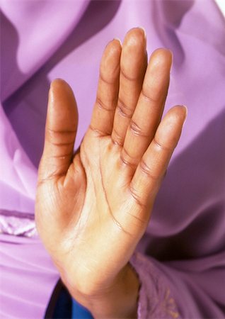 Woman's palm held up in prayer, close-up Foto de stock - Sin royalties Premium, Código: 695-03383623