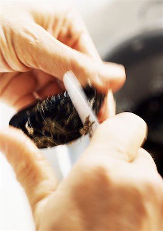 scraping - Close-up of hands cleaning mussels with small knife Stock Photo - Premium Royalty-Free, Code: 695-03383793