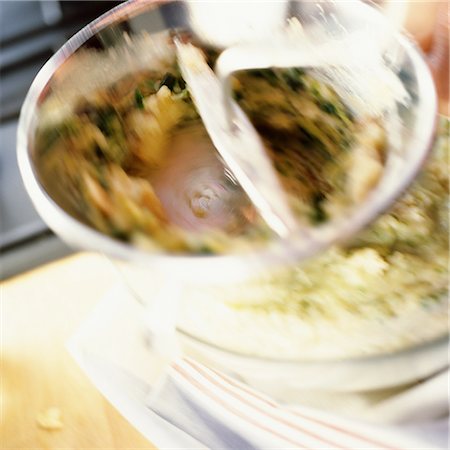 smashed potatoes - Close-up of food being mashed in foodmill, blurry Stock Photo - Premium Royalty-Free, Code: 695-03383801