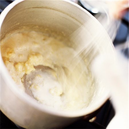 Close-up of bechamel sauce being cooked in a pot Stock Photo - Premium Royalty-Free, Code: 695-03383812