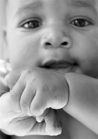 Baby looking at camera, close-up, b&w Stock Photo - Premium Royalty-Free, Code: 695-03383921