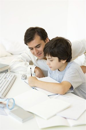 Father helping son with his homework Stock Photo - Premium Royalty-Free, Code: 695-03390089
