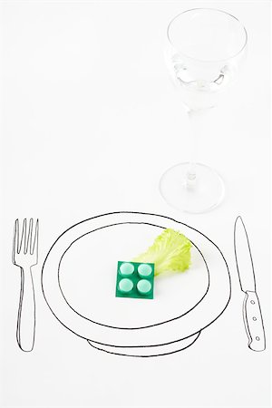 plate space - Pills and single leaf of lettuce on drawing of plate Stock Photo - Premium Royalty-Free, Code: 695-03390159