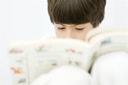 simsearch:632-03027019,k - Boy reading book, close-up Stock Photo - Premium Royalty-Free, Code: 695-03390265