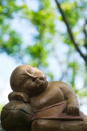 sculpted - Sleeping Buddha statue, close-up Stock Photo - Premium Royalty-Free, Code: 695-03390455