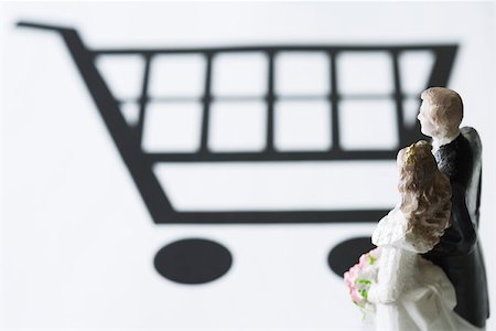 simsearch:695-03390454,k - Bride and groom figures looking at shopping cart Stock Photo - Premium Royalty-Free, Code: 695-03390466