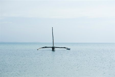 Zanzibar, Tanzania, trimaran on ocean Stock Photo - Premium Royalty-Free, Code: 695-03390565