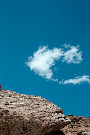 simsearch:695-03373539,k - Rocky outcropping, single wispy cloud in sky, low angle view Stock Photo - Premium Royalty-Free, Code: 695-03390568